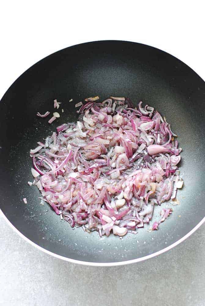 Onions frying in a wok