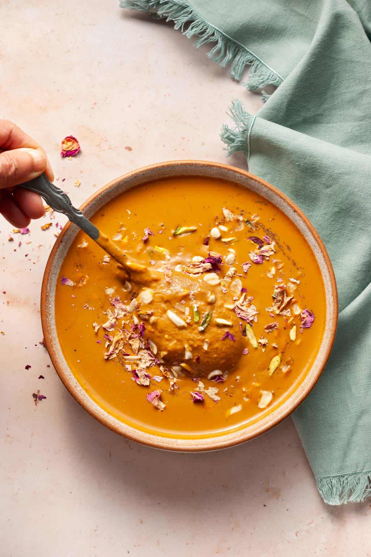 Sweet potato kheer in a bowl with a spoon.