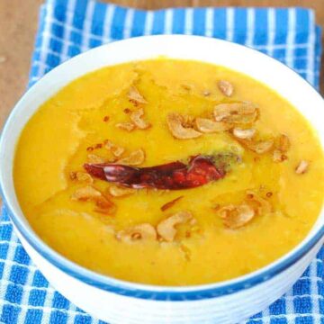 toor dal in a bowl on a blue napkin