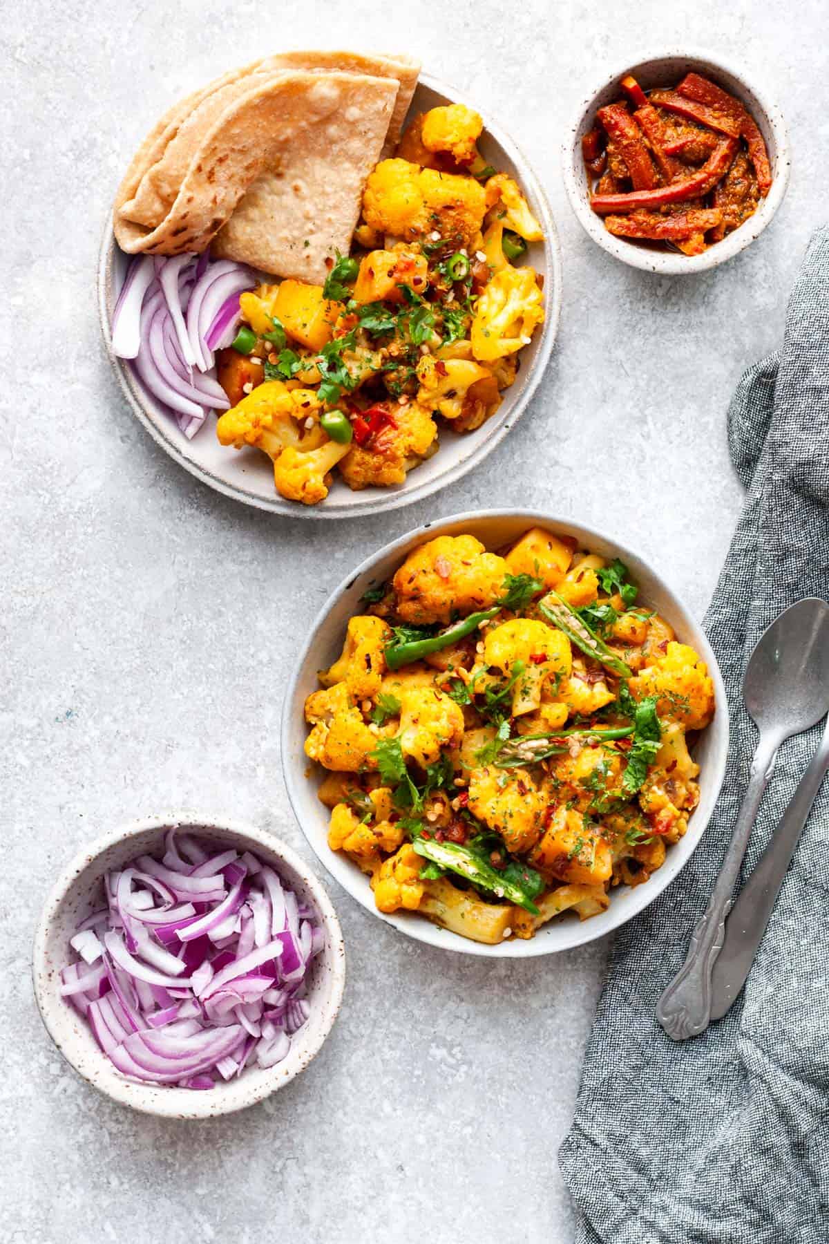 aloo gobi with roti and sliced onions