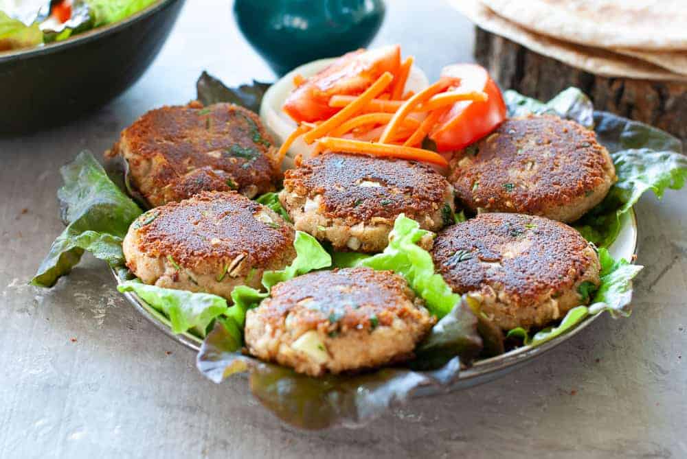 Shami Kebabs on a bed of lettuce and salad