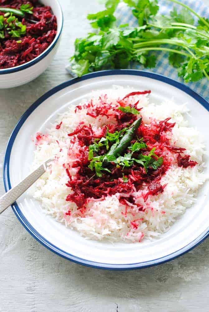 beetroot sabzi over plain white rice in a plate