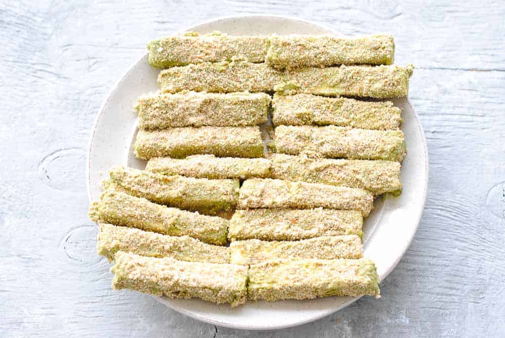 Breaded paneer fingers on a plate