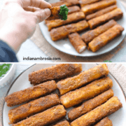 paneer fingers on a plate with a hand over it holding a piece dipped in green chutney