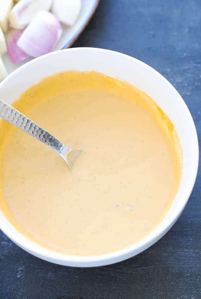 marinade for paneer kabab in a bowl with a spoon