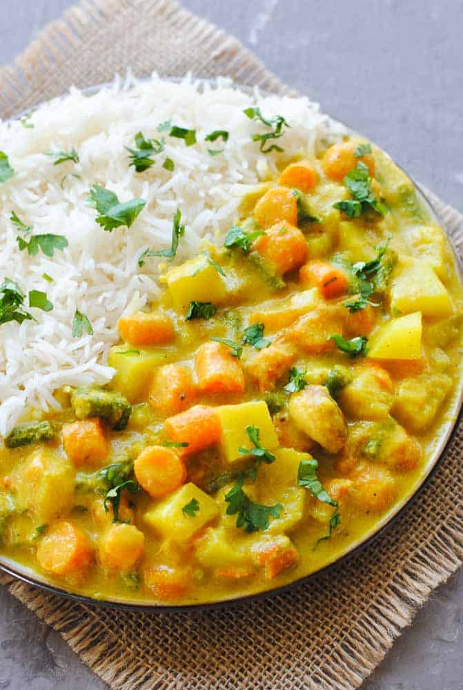 vegetable korma and rice in a plate