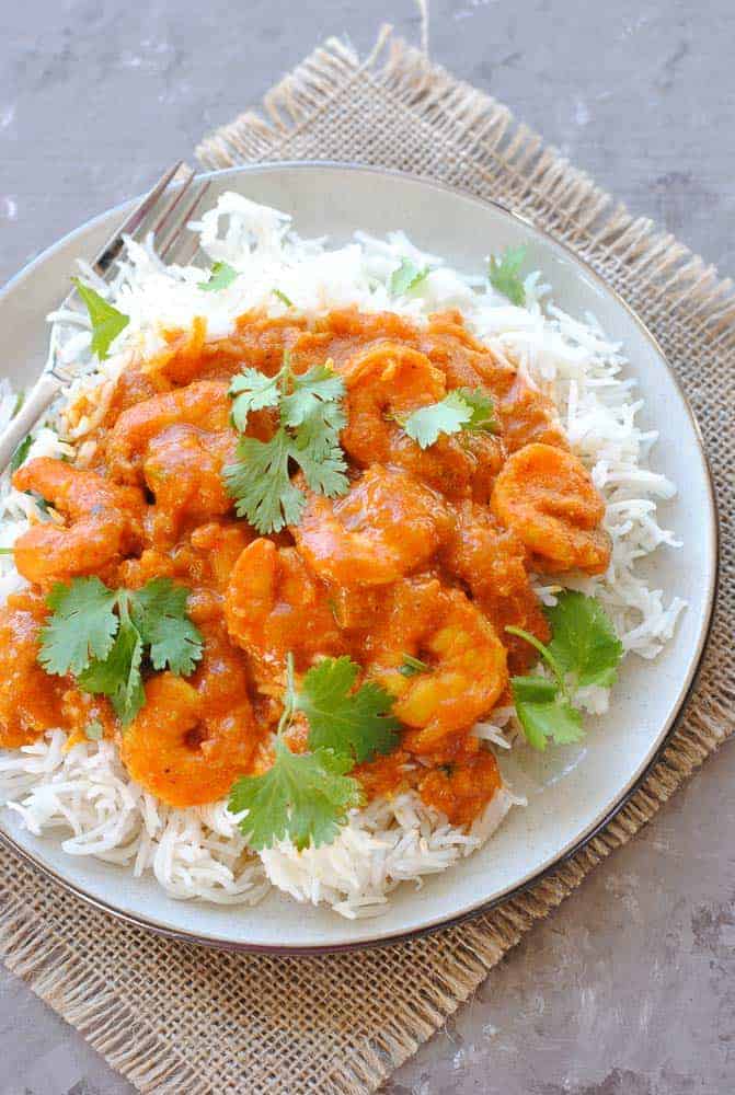 shrimp curry over rice in a plate
