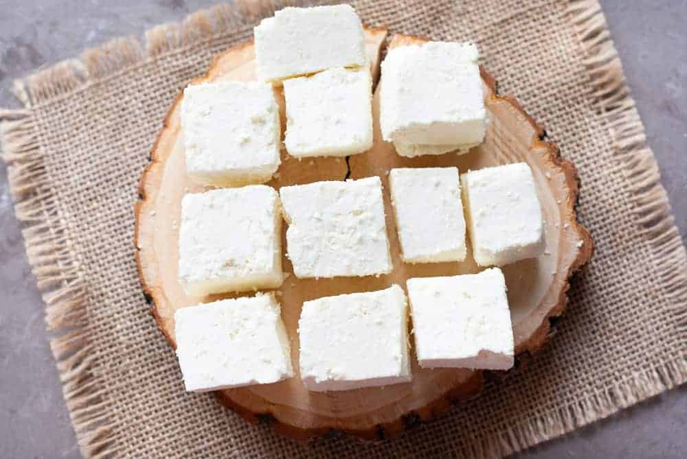 paneer cubes on a wooden board
