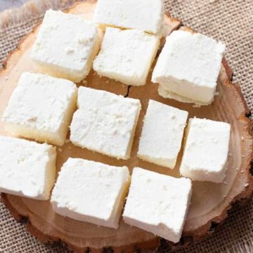 paneer cubes on a wooden block