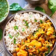 butternut squash and chickpea curry in bowl with brown rice