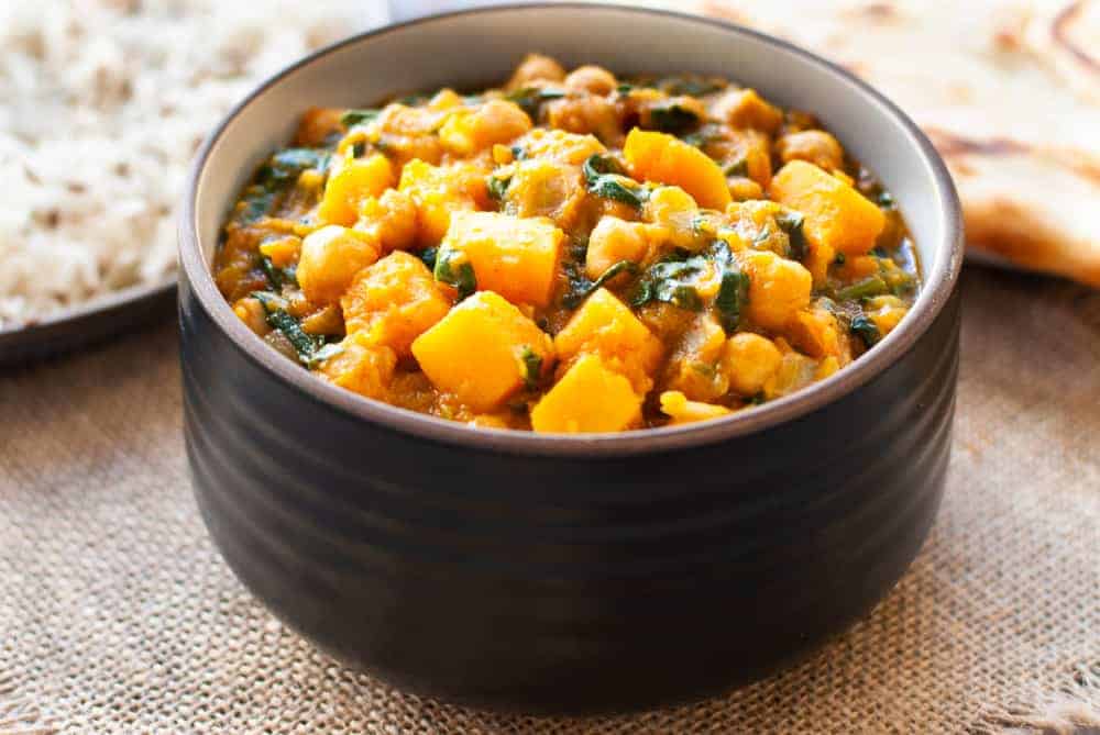 butternut squash and chickpea curry in brown bowl