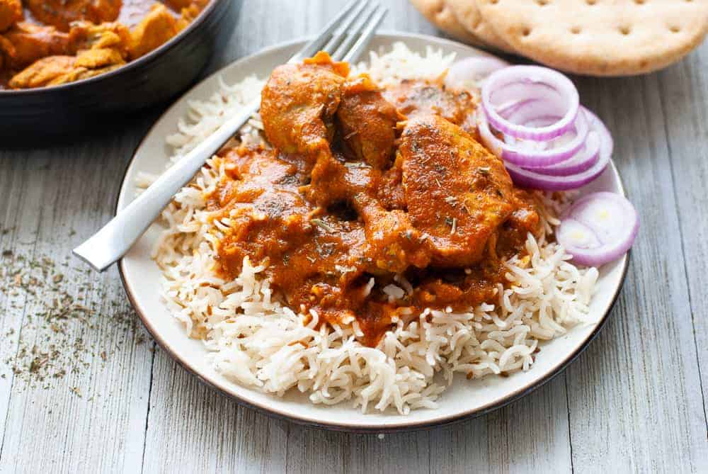 chicken madras over rice in plate.