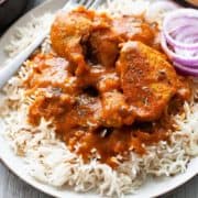 chicken madras curry over rice in plate