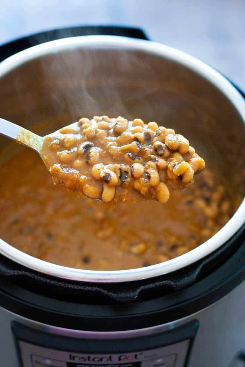 black eyed peas curry in a spoon over the instant pot 