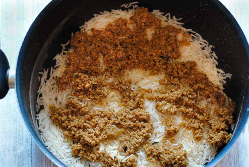 Rice and keema layers in a big pot