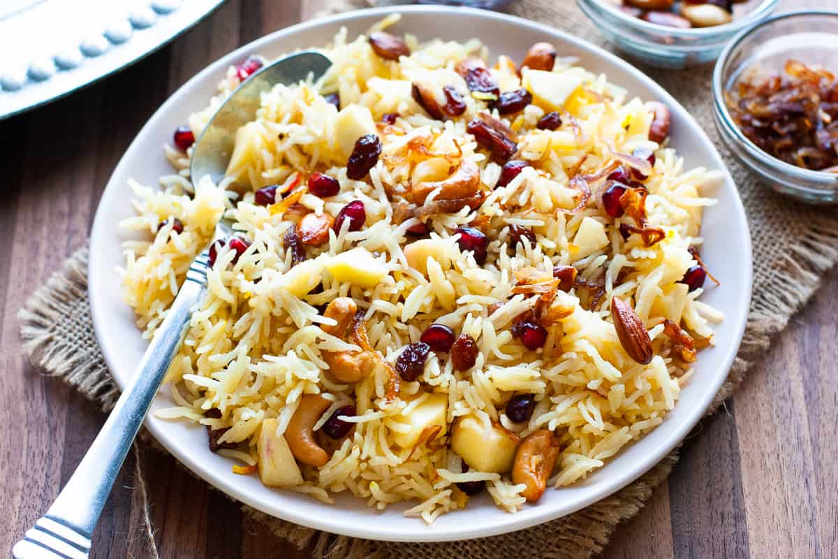 Kashmiri Pulao in plate with a spoon