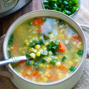 sweet corn soup in bowl with spoon