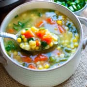 sweet corn soup in bowl with spoon