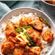 karahi chicken over rice in bowl