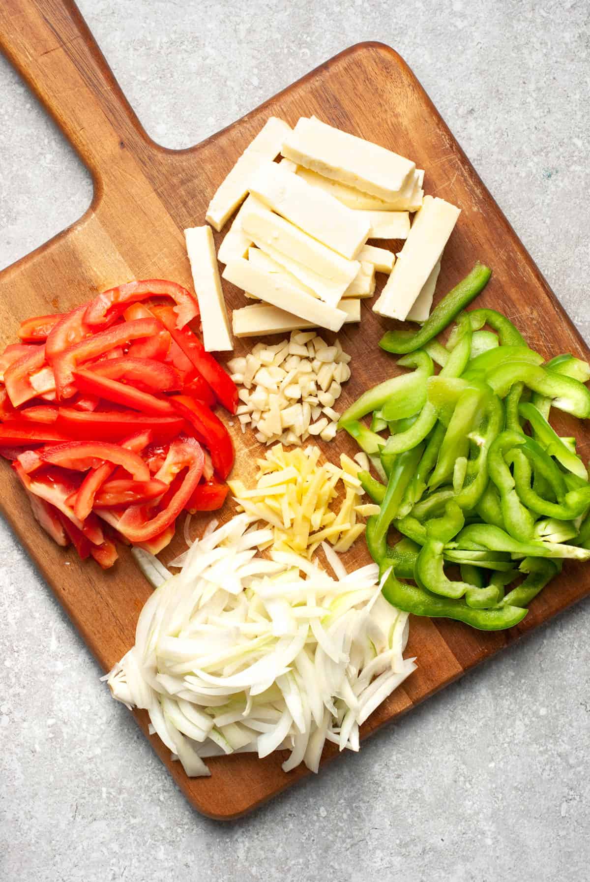 vegetables and cottage cheese on a cutting board