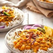chana dal over rice on a plate