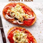two naan pizza with a knife