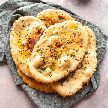 wholewheat naan bread on a grey napkin