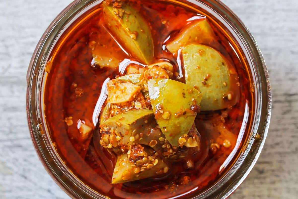 Aam ka achar (mango pickle) in a glass bowl.