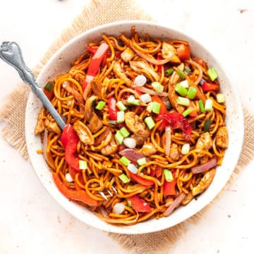 Chicken Hakka Noodles in a bowl with a fork