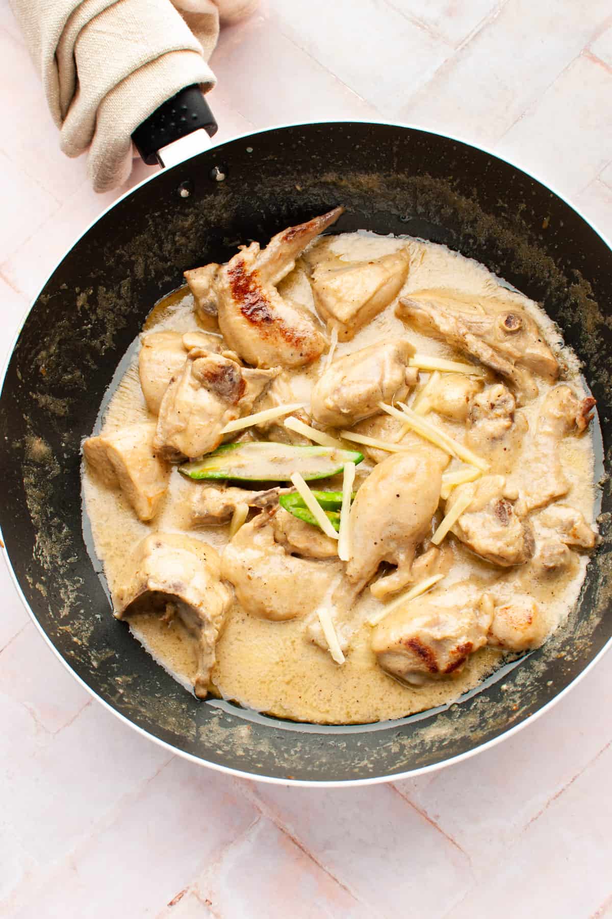 White chicken karahi in a wok.