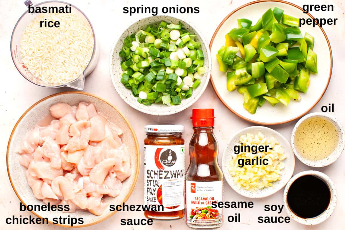 Labelled ingredients for schezwan chicken fried rice.