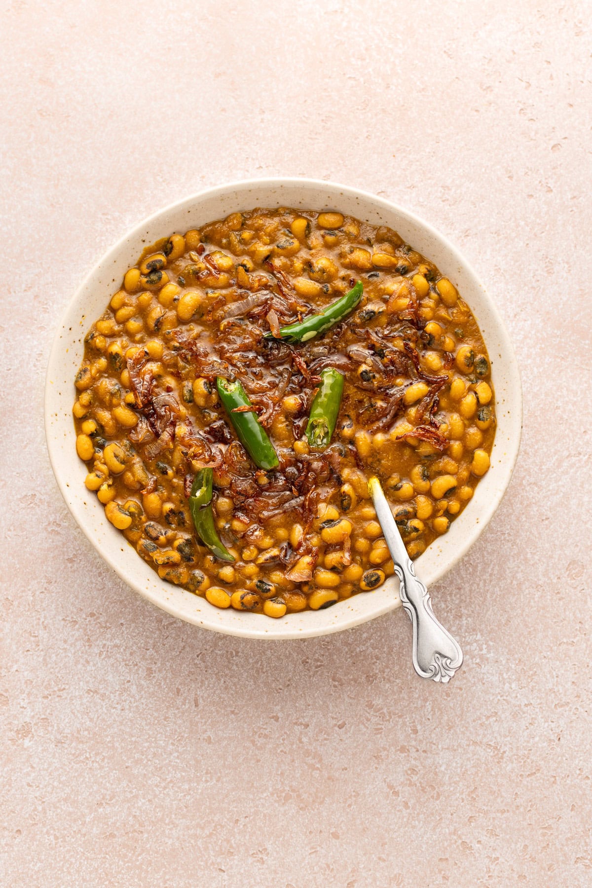Lobia (black eyed peas curry) in a bowl with spoon.